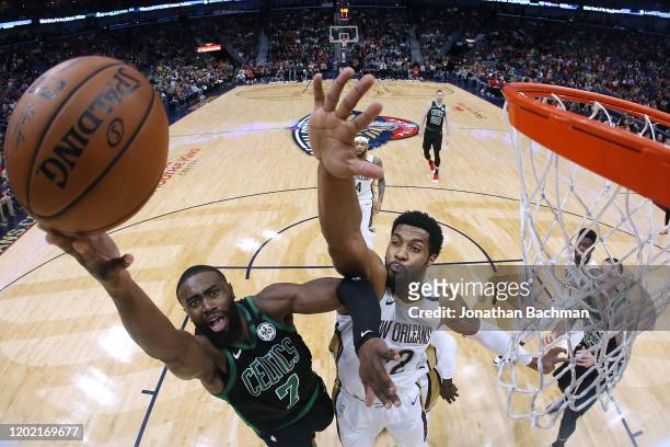 Jaylen Brown of the Boston Celtics shoots against Derrick Favors of the New Orleans Pelicans during the first half at the Smoothie King Center on...