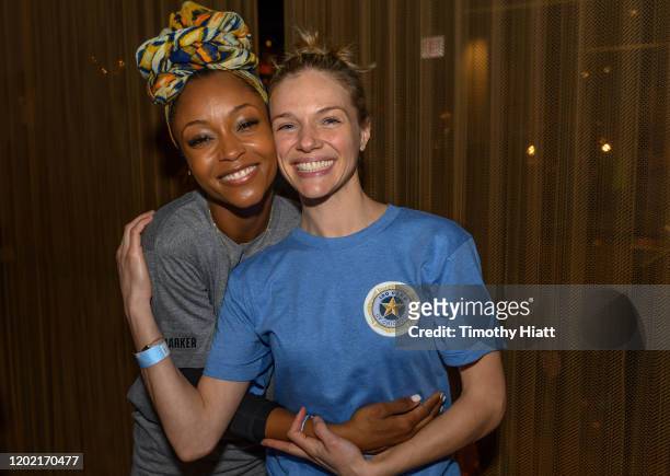YaYa DaCosta and Tracy Spiridakos participate in the "Paddle Battle" to benefit the 100 Club of Chicago at SPiN Chicago on January 26, 2020 in...