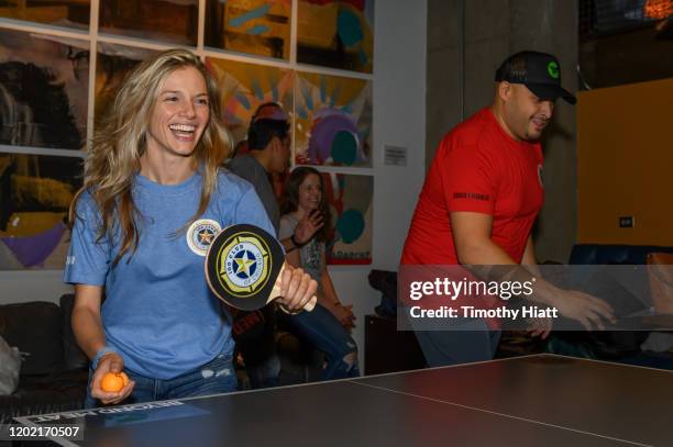 Tracy Spiridakos and Joe Minoso participate in the "Paddle Battle" to benefit the 100 Club of Chicago at SPiN Chicago on January 26, 2020 in Chicago,...