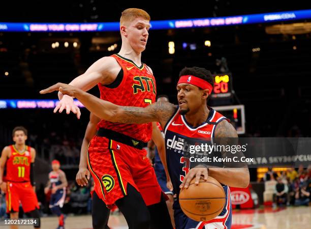 Bradley Beal of the Washington Wizards drives against Kevin Huerter of the Atlanta Hawks in the first half at State Farm Arena on January 26, 2020 in...
