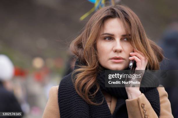 People are seen at the monument of the Heavenly Hundred near Independence Square in Kyiv, Ukraine on February 20, 2020. Six years ago over a hundred...