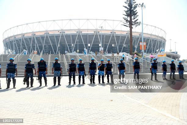 Para-military soldiers from the Rapid Action Force stand in front of Sardar Patel Stadium, in Motera, on the outskirts of Ahmedabad, on February 21,...