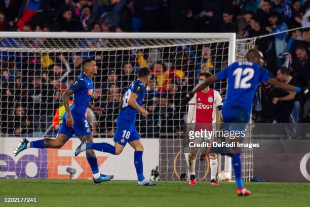 Robert Kenedy of Getafe CF celebrates after scoring his team's second goal with teammates during the UEFA Europa League round of 32 first leg match...