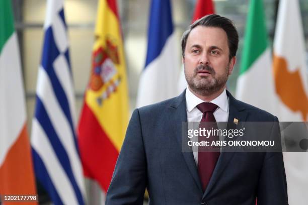 Luxembourg's Prime Minister Xavier Bettel arrives for the second day of a special European Council summit in Brussels on February 21 held to discuss...