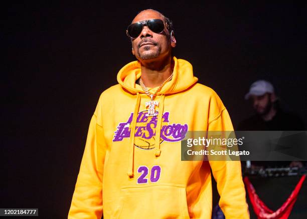 Snoop Dogg performs, while wearing a Los Angeles Lakers sweat suit in memory of Kobe Bryant, at The Fillmore on January 26, 2020 in Detroit,...