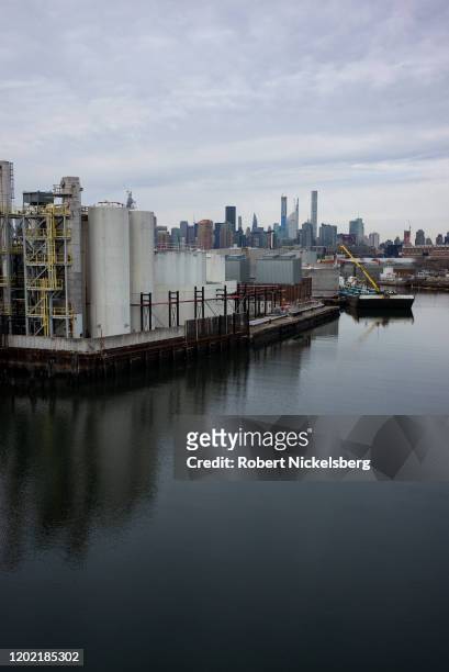 View across the Brooklyn-side of the Newtown Creek, left, shows fuel storage tanks belonging to the United Metro Energy Company in the Greenpoint...