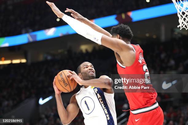 Warren of the Indiana Pacers takes a shot against Hassan Whiteside of the Portland Trail Blazers in the fourth quarter during their game at Moda...