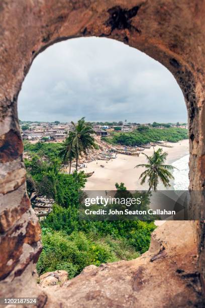 ghana, window at fort good hope on the atlantic ocean - fortress stockfoto's en -beelden