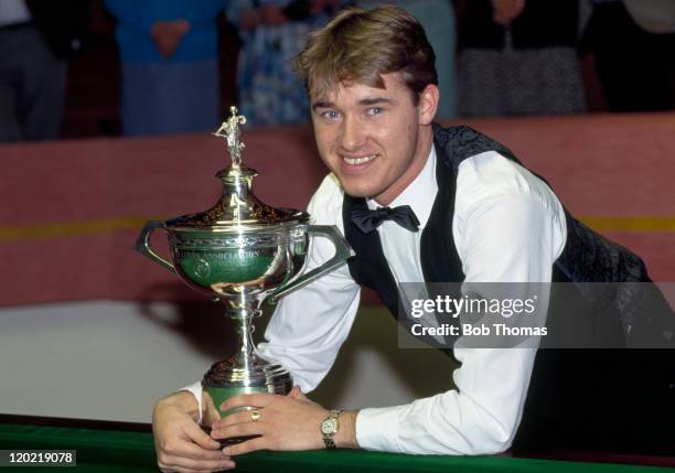 Stephen Hendry of Scotland with the trophy after defeating Jimmy White 18-5 in the World Snooker Championship Final at the Crucible in Sheffiield on...