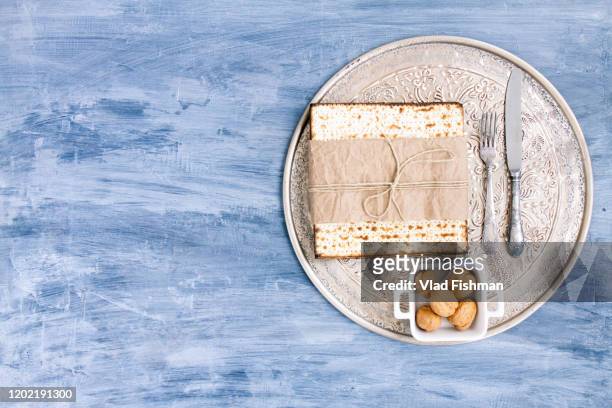 metal plate with matzah or matza - passover symbols stock pictures, royalty-free photos & images