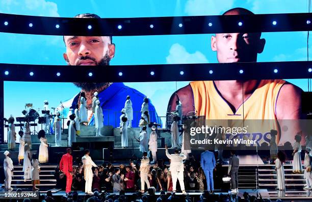 Images for the late Nipsey Hussle and Kobe Bryant are projected onto a screen while YG, John Legend, Kirk Franklin, DJ Khaled, Meek Mill, and Roddy...