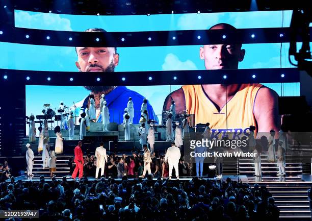 Images for the late Nipsey Hussle and Kobe Bryant are projected onto a screen while YG, John Legend, Kirk Franklin, DJ Khaled, Meek Mill, and Roddy...