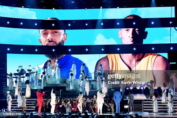 Images for the late Nipsey Hussle and Kobe Bryant are projected onto a screen while YG, John Legend, Kirk Franklin, DJ Khaled, Meek Mill, and Roddy...