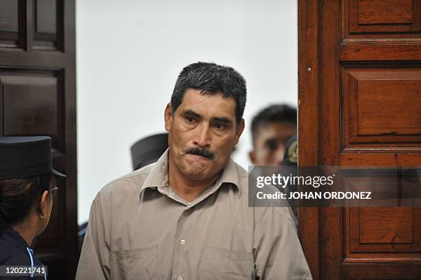 Manuel Pop, one of the four military men accused of the murder of 252 farmers in 1982, arrive at court during their trial, in Guatemala City, on...