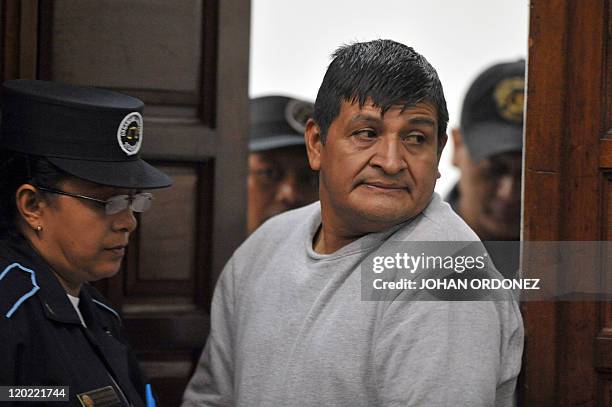 Daniel Martinez Mendez, one of the four military men accused of the murder of 252 farmers in 1982, arrive at court during their trial, in Guatemala...