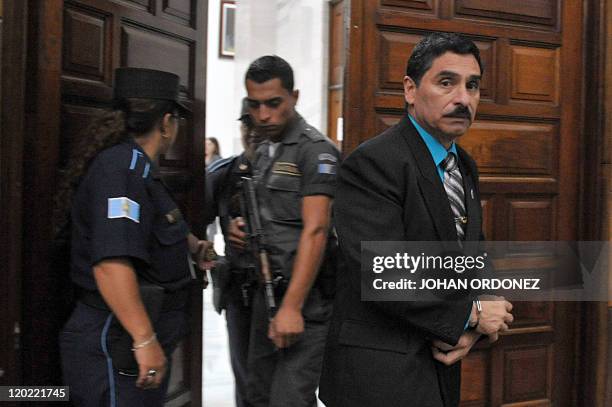 Carlos Antonio Carias Lopez, one of four military men accused of the murder of 252 farmers in 1982, arrive at court during their trial, in Guatemala...