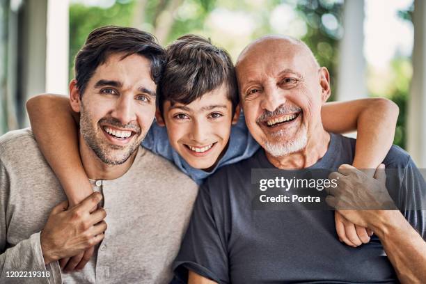 portrait of smiling multi-generation family - grandfather stock pictures, royalty-free photos & images