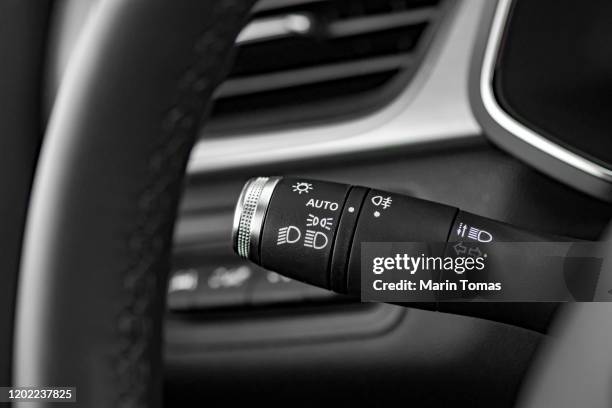 modern car automatic headlights - knob stock pictures, royalty-free photos & images