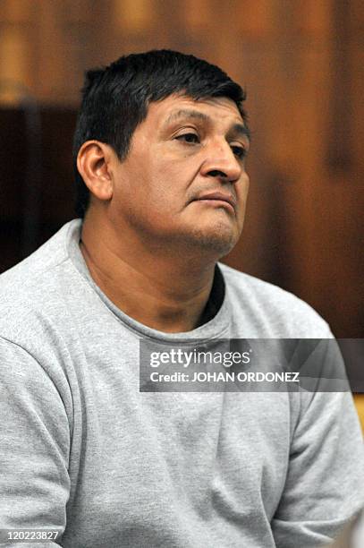 Daniel Martinez Mendez, one of the four military men accused of the murder of 252 farmers in 1982, gestures during their trial, in Guatemala City, on...