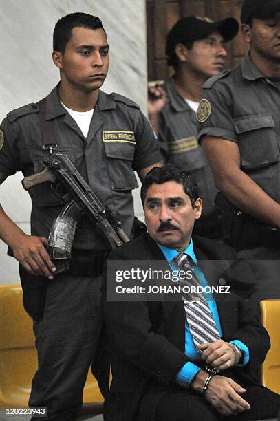 Carlos Antonio Carias Lopez, one of four military men accused of the murder of 252 farmers in 1982, during their trial, in Guatemala City, on August...