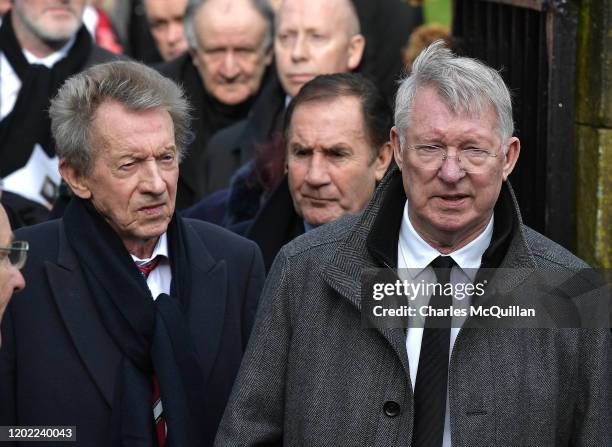 Sir Alex Ferguson and Denis Law can be seen with fellow mourners as the funeral of former Manchester United and Northern Ireland footballer Harry...