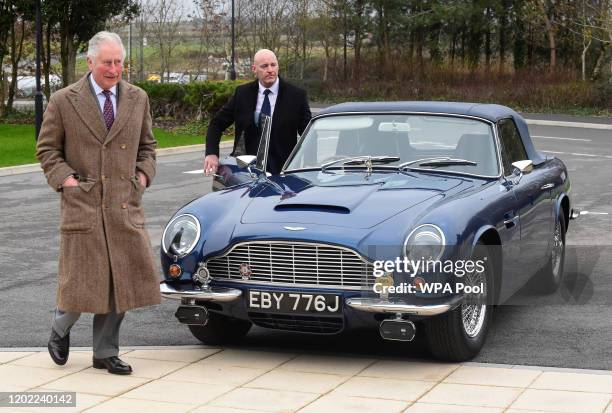 Prince Charles, Prince of Wales is seen next to his Aston Martin DB6, during his visit to the new Aston Martin Lagonda factory on February 21, 2020...