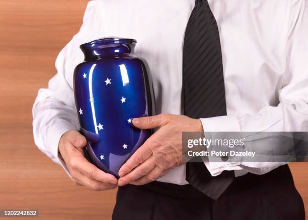 funeral director with cremation urn - decorative urn ストックフォトと画像