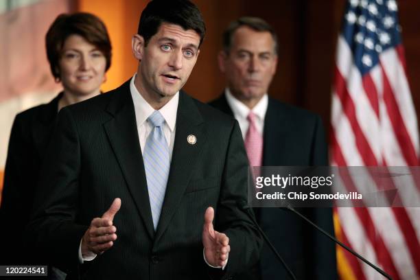 House Budget Committee Chairman Paul Ryan talks about the bipartisan debt ceiling compromise legislation during a news conference with Speaker of the...