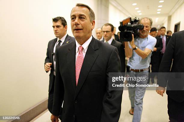 Speaker of the House John Boehner leaves a news conference where he encouraged Republican members to support a bipartisan debt ceiling deal at the...