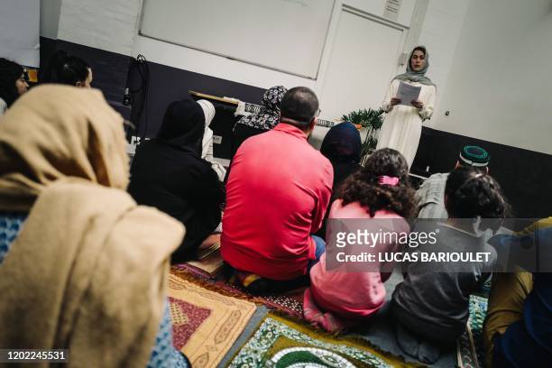 French female imam Kahina Bahloul leads a friday prayer in a rented venue of the 11th arrondissement of Paris on February 21, 2020. - Bahloul is...