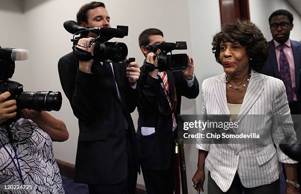 Rep. Maxine Waters heads into a meeting with House Democrats and Vice President Joe Biden at the U.S. Capitol August 1, 2011 in Washington, DC. The...