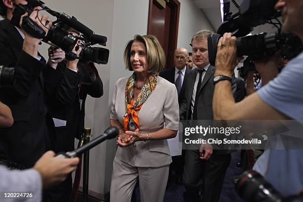 House Minority Leader Nancy Pelosi arrives for a meeting with House Democrats and Vice President Joe Biden at the U.S. Capitol August 1, 2011 in...