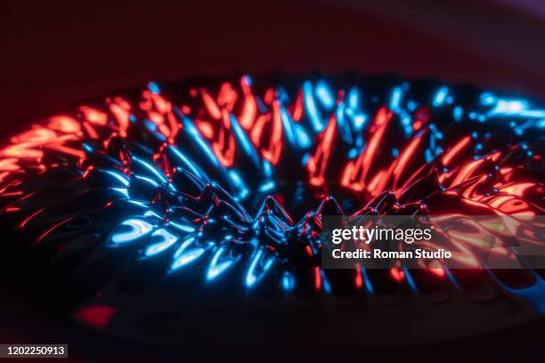 sculpture of ferrofluid induced by a neodymium magnet - ferro stockfoto's en -beelden