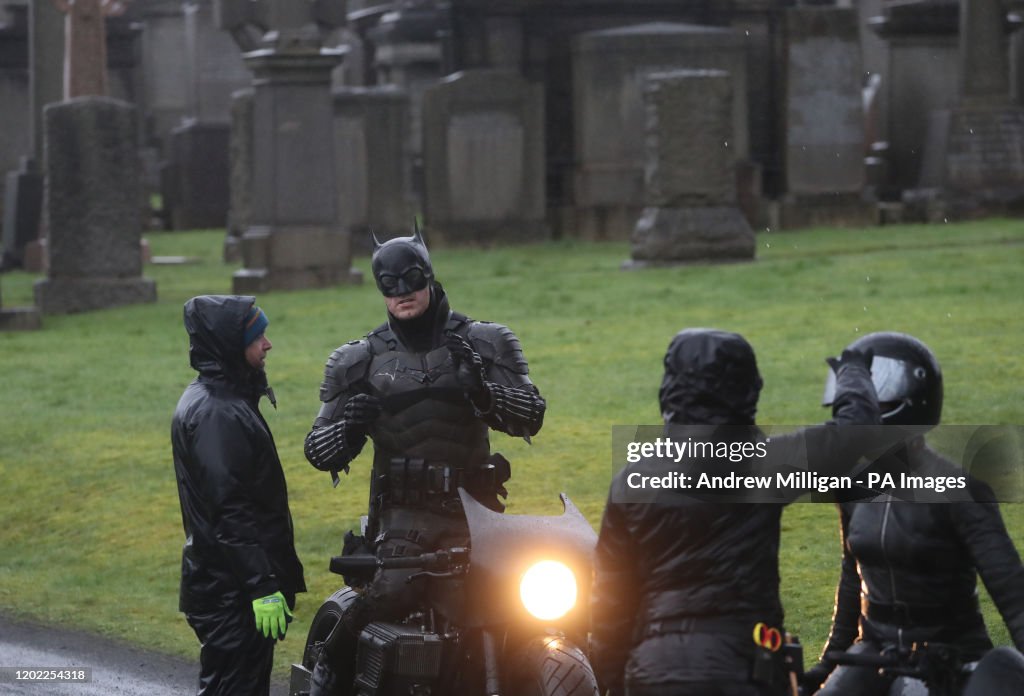 A Man Dressed As Batman During Filming At The Glasgow Necropolis a-man-dressed-as-batman-during-filming-at-the-glasgow-necropolis