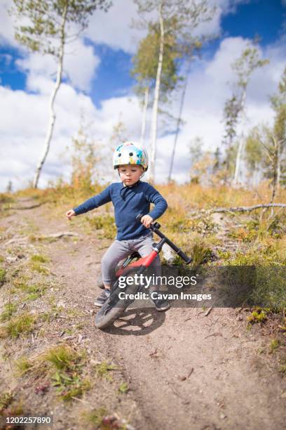 toddler boy falling after crash while biking - sked stock pictures, royalty-free photos & images