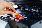 office equipment maintenance and service - hand replace inkjet printer cartridge