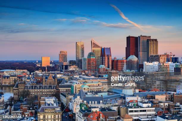 aerial view on the city centre of the hague at dusk - the hague stock pictures, royalty-free photos & images
