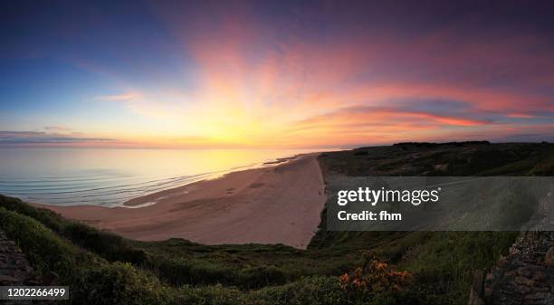 sunset at the coastline (normandy, france) - manche stock pictures, royalty-free photos & images