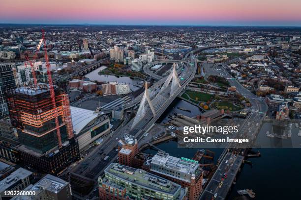 boston aerial views above zakim bridge at sunrise. - zakim bridge stock pictures, royalty-free photos & images