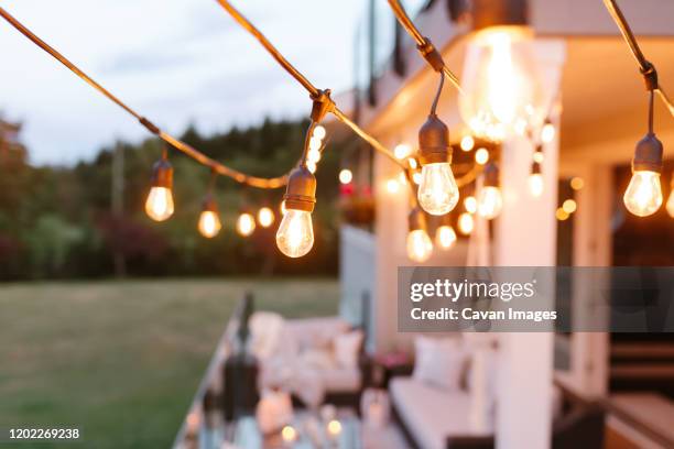 string lights - patio lights stock-fotos und bilder