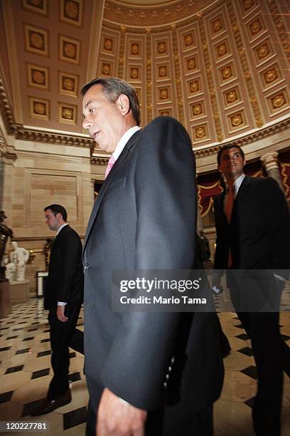 Speaker of the House John Boehner walks towards the House chamber for the House vote on the debt extension at the U.S. Capitol on August 1, 2011 in...