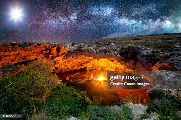 ghajn tuta cave by night - cave fire stock pictures, royalty-free photos & images