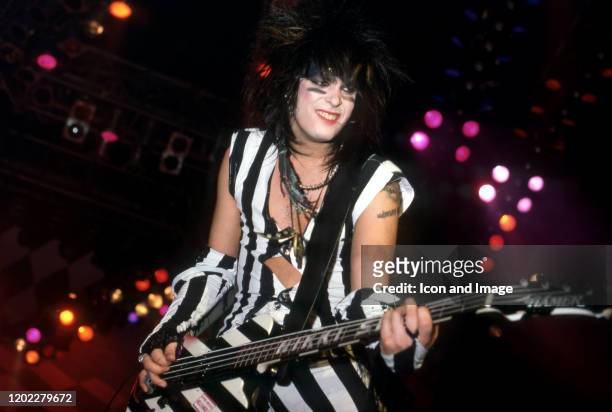Motley Crüe bassist Nikki Sixx performs while they are the opening act during Ozzy Osbourne's Bark at the Moon Tour on March 6 at Joe Louis Arena in...