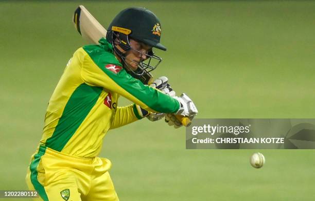Australia's Alex Carey playing a shot during the first T20 international cricket match between South Africa and Australia at The Wanderers Stadium in...