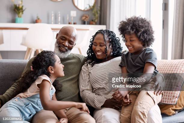 sie bringen so viel glück und spaß in unser leben - african family stock-fotos und bilder
