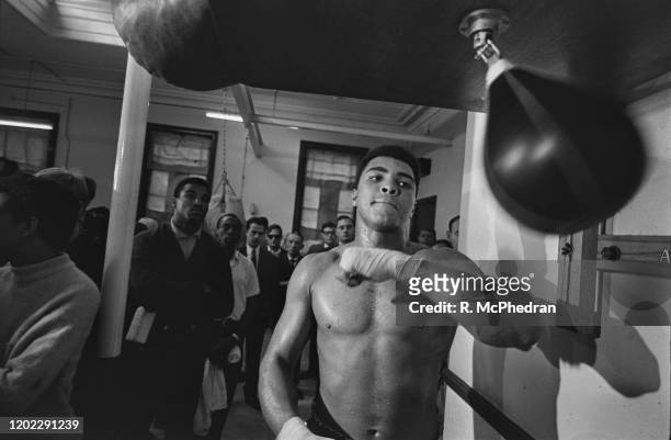 American boxer Muhammad Ali training with a speed bag ahead of his fight against Britain's Brian London, in London, England, 3rd August 1966.