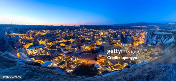 high angle view of goreme at dusk, cappadocia - göreme stock-fotos und bilder