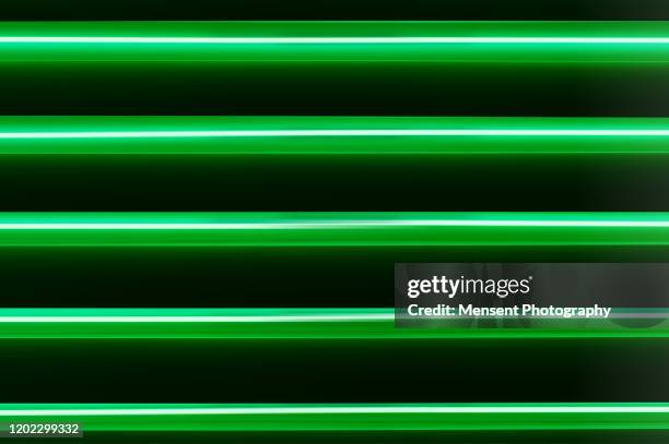 futuristic abstract colorful display of neon lights - tube néon photos et images de collection