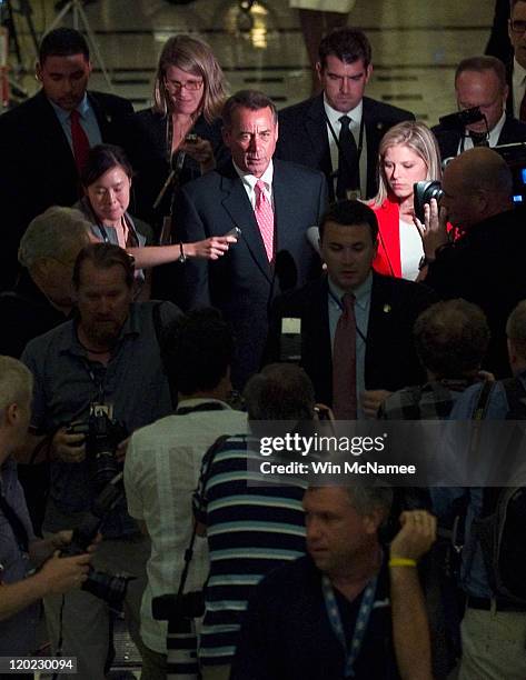 Speaker of the House John Boehner is surrounded by reporters after the House voted to raise the debt ceiling at the U.S. Capitol on August 1, 2011 in...