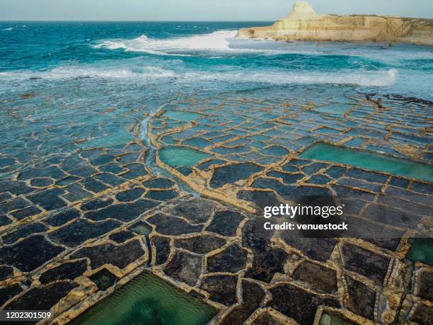 drone photo - salt pans of gozo, malta stock photo - gozo malta fotografías e imágenes de stock